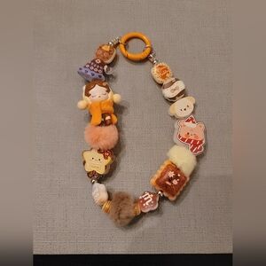 Cute Skull Panda Themed Bag Charm with Orange & Brown Accents